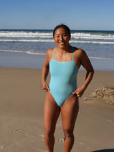 Surf Ironwoman Sara wears the Siena one piece designed by JAYD Swimwear, this one piece is fixed back and made with chlorine resistant material. It is built for performance.